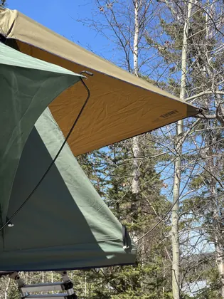 Volvo XC60 with rooftop tent at camp
